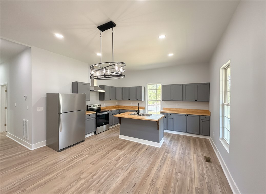 115 Hunter Street Anderson, SC 29625 - Photo 9 of 21 This spacious kitchen offers ample room for culinary creativity and gatherings.