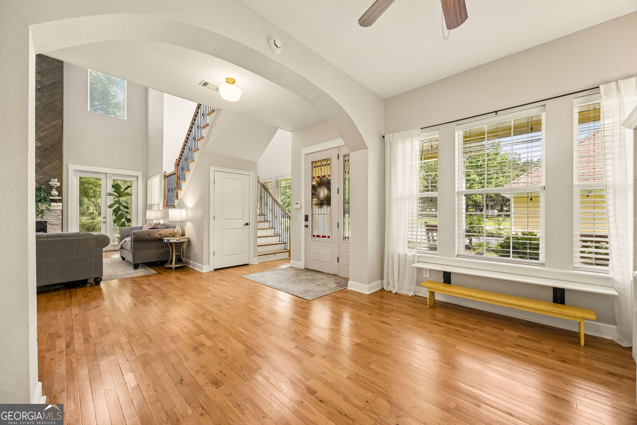 706 Hopewell Point Road White Oak, GA 31568 - Photo 13 of 84 Hardwood flooring, oversized windows, and seamless flow to the foyer and great room make this an inviting extension of the home's open-concept design.