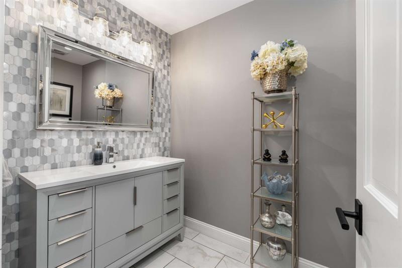 1678 Nottingham Way Northeast Atlanta, GA 30309 - Photo 15 of 59 a bathroom with a sink mirror and vanity