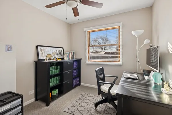 a workspace with furniture and window