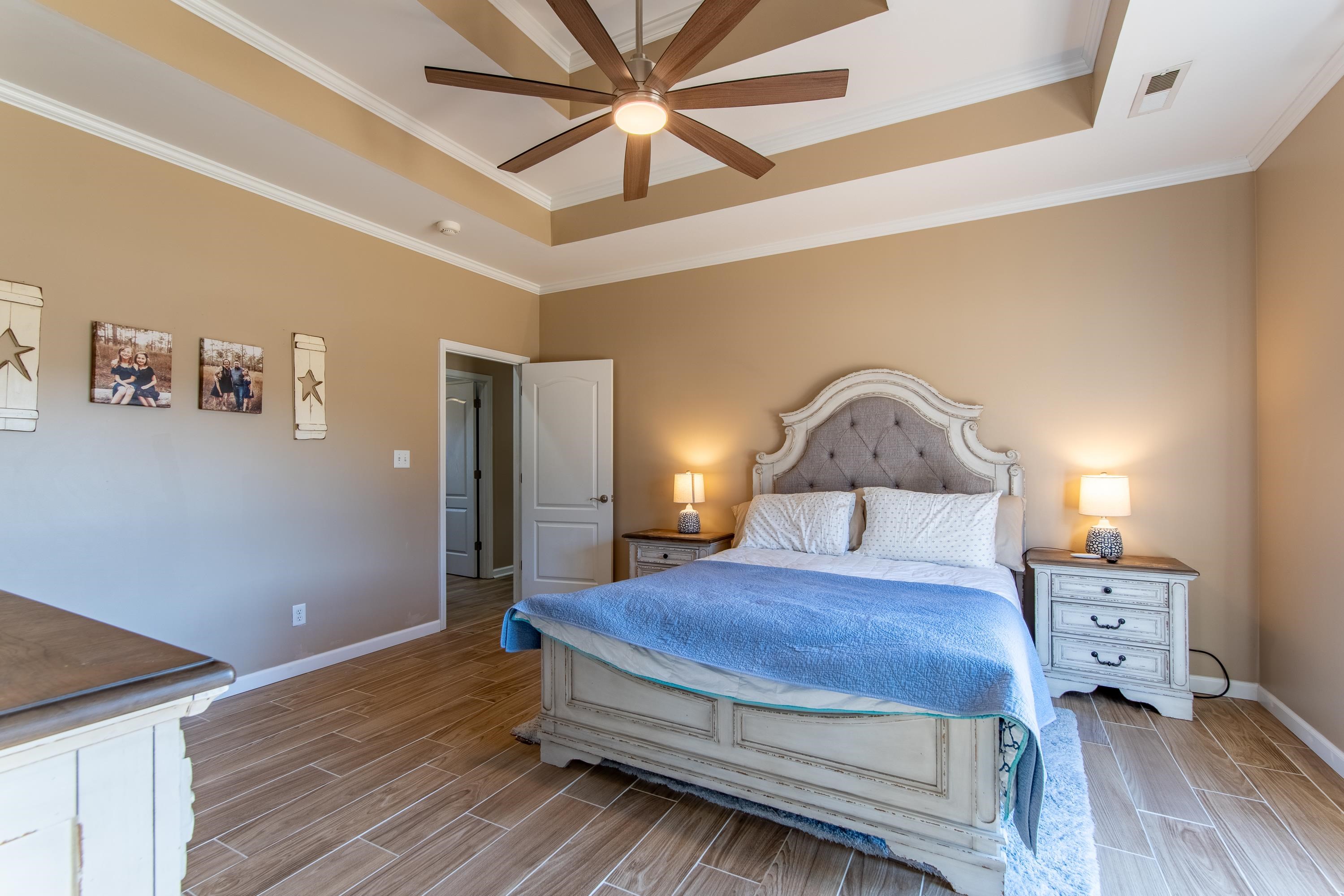 4 Rabbit Cove Corinth, MS 38834 - Photo 16 of 28 a bedroom with a bed mirror and a window