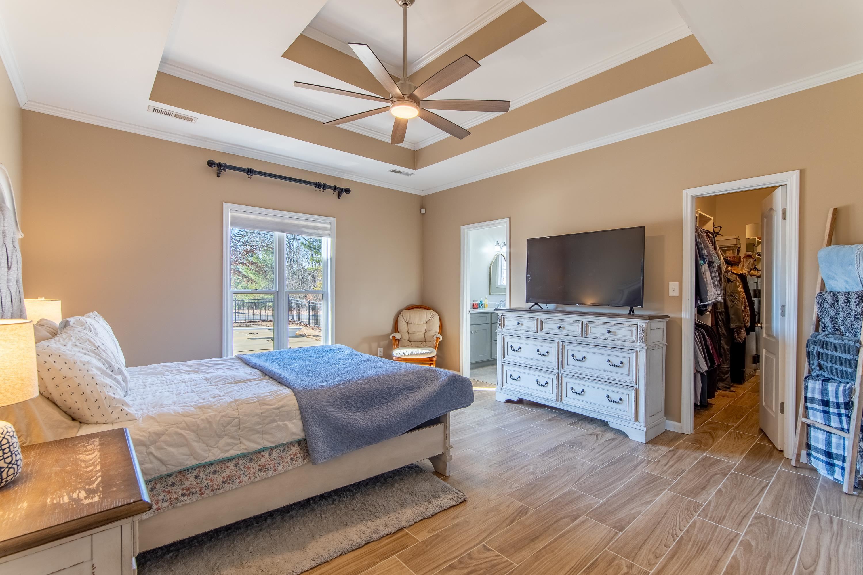 4 Rabbit Cove Corinth, MS 38834 - Photo 17 of 28 a bedroom with a bed and a flat screen tv