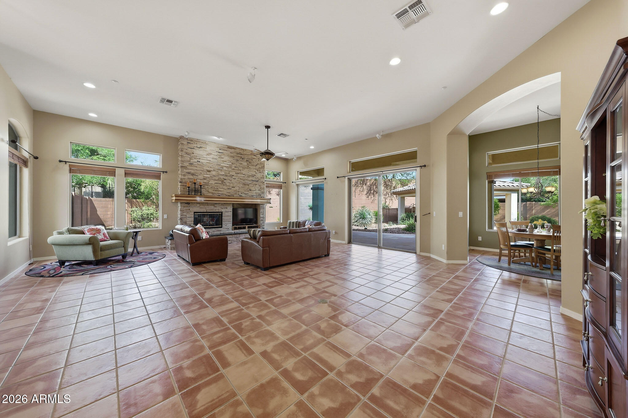 2129 West Legends Way Anthem, AZ 85086 - Photo 12 of 57 a living room with furniture and a table