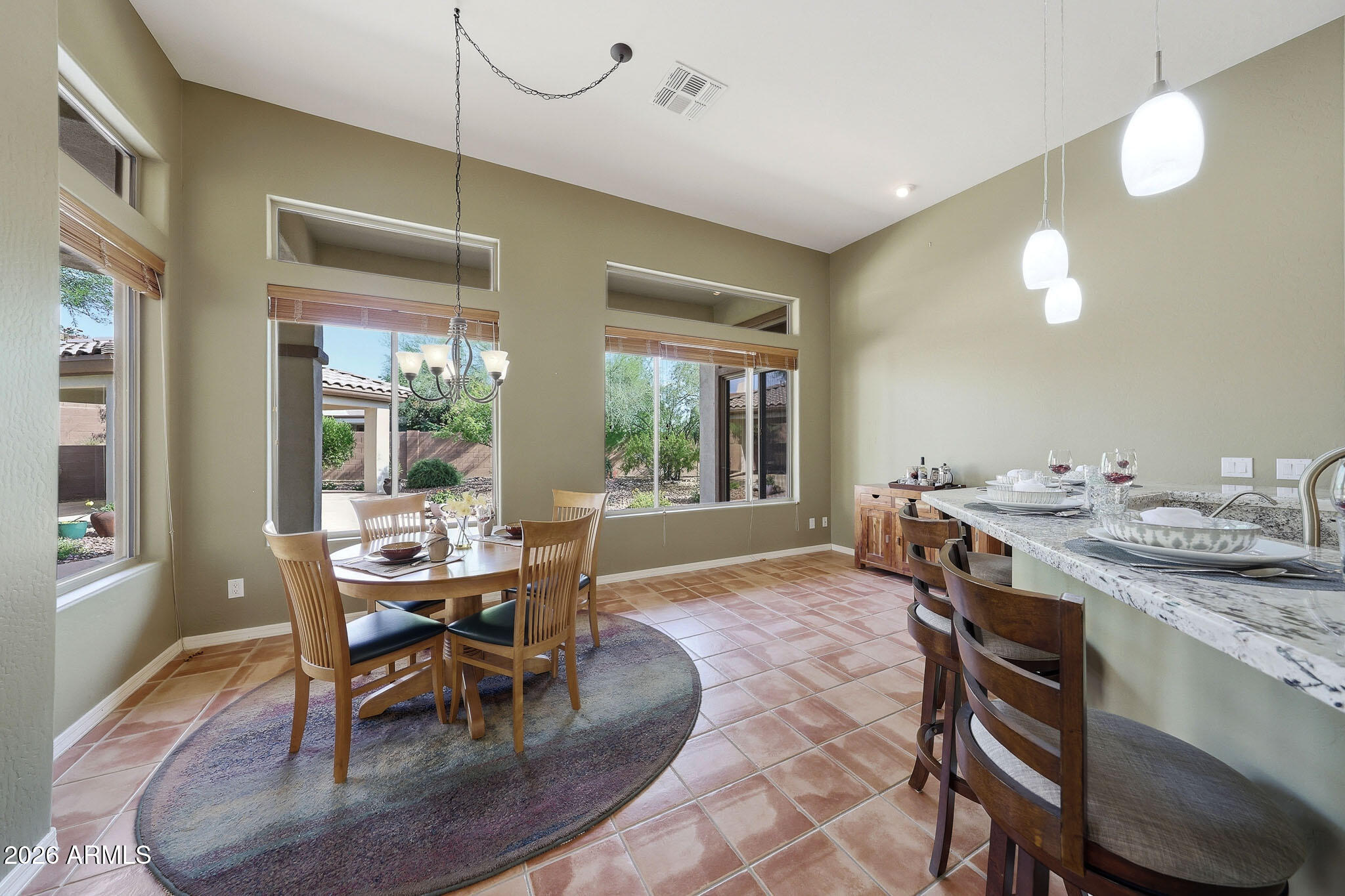 2129 West Legends Way Anthem, AZ 85086 - Photo 17 of 57 a view of a dining room with furniture