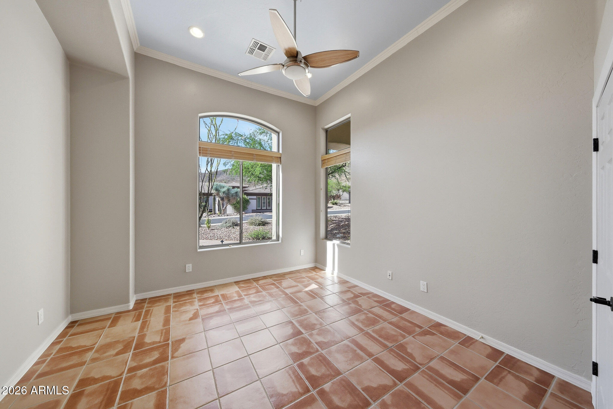 2129 West Legends Way Anthem, AZ 85086 - Photo 21 of 57 a view of an empty room with window and chandelier fan