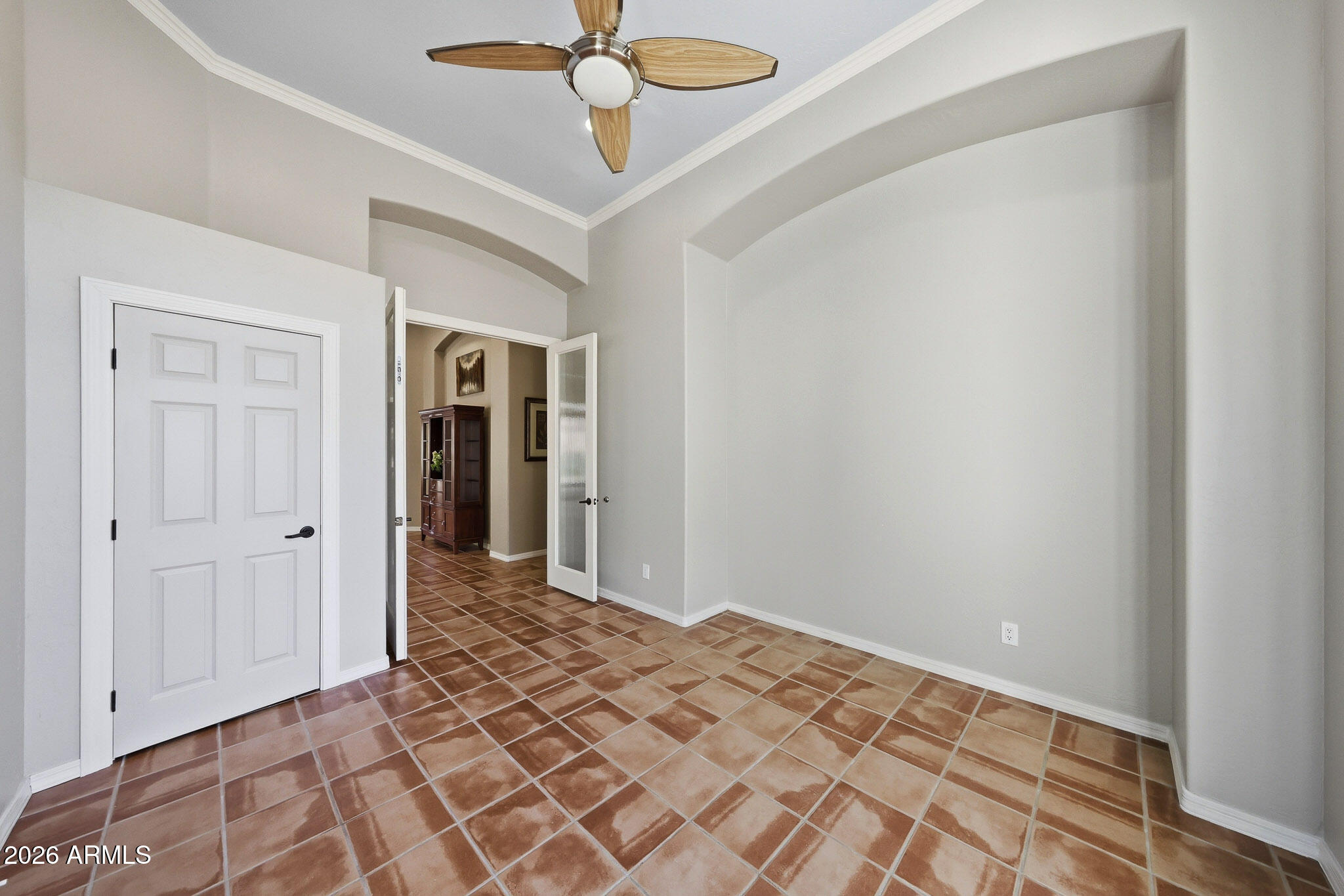 2129 West Legends Way Anthem, AZ 85086 - Photo 23 of 57 a view of a room with a chandelier fan and wooden floor
