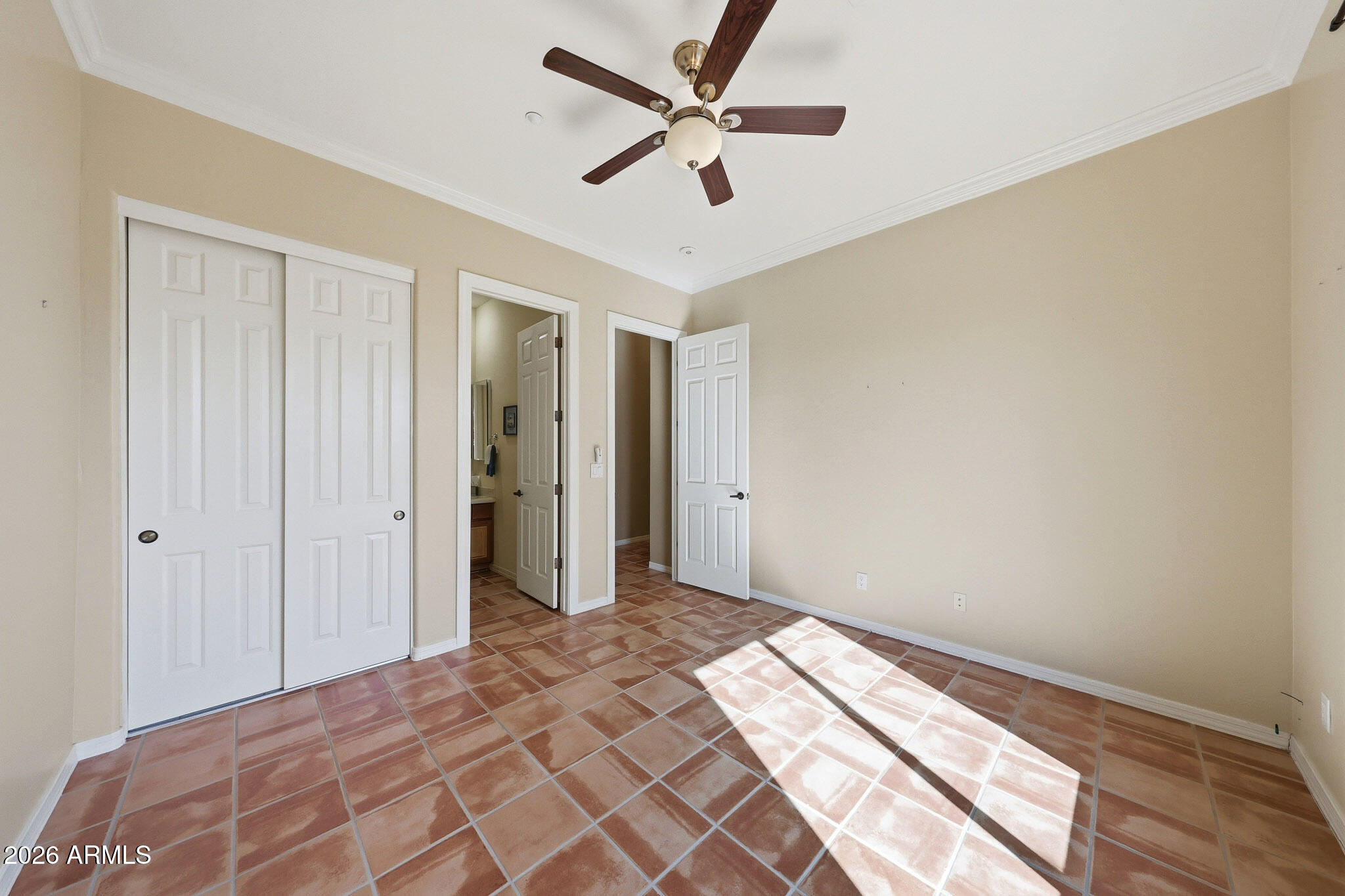 2129 West Legends Way Anthem, AZ 85086 - Photo 28 of 57 a bedroom with bed and a chandelier fan