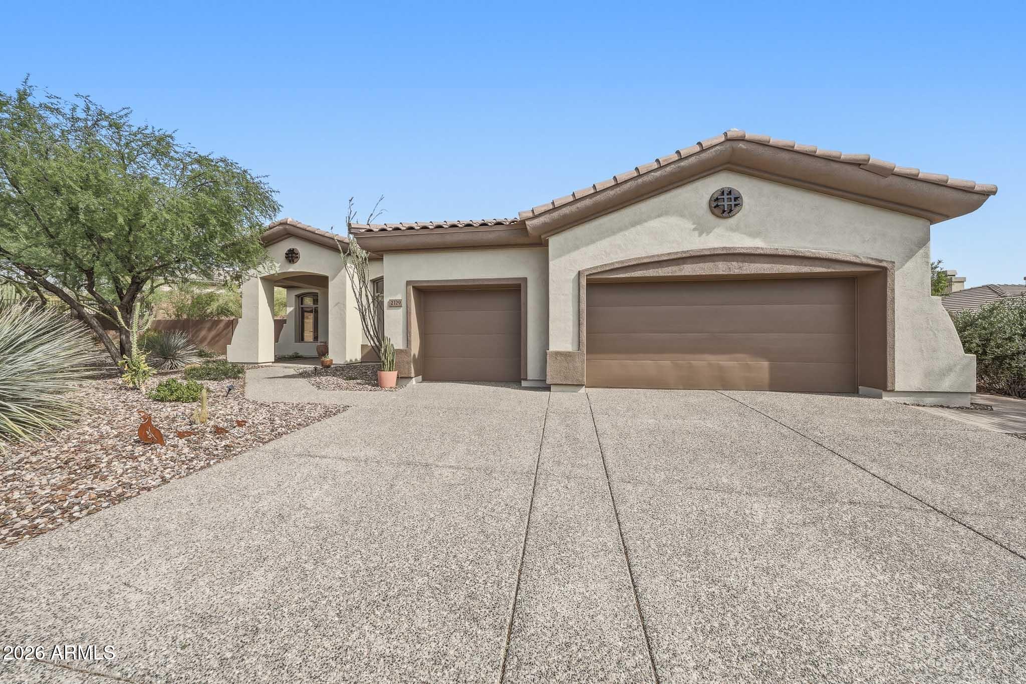2129 West Legends Way Anthem, AZ 85086 - Photo 3 of 57 front view of a house with a yard