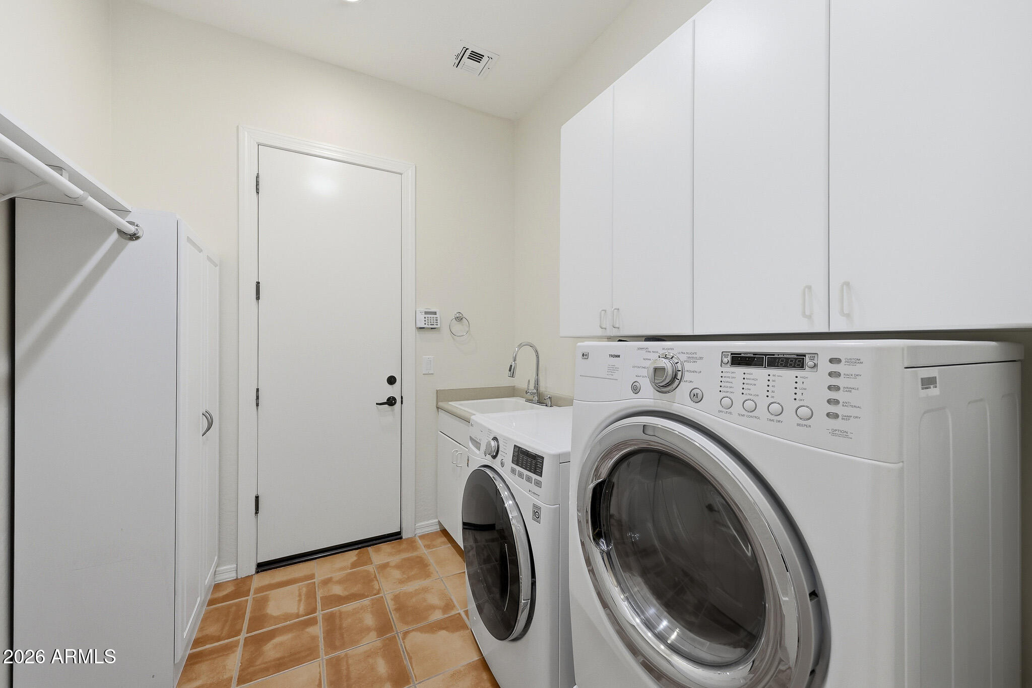 2129 West Legends Way Anthem, AZ 85086 - Photo 38 of 57 a view of a storage & utility room with washer and dryer