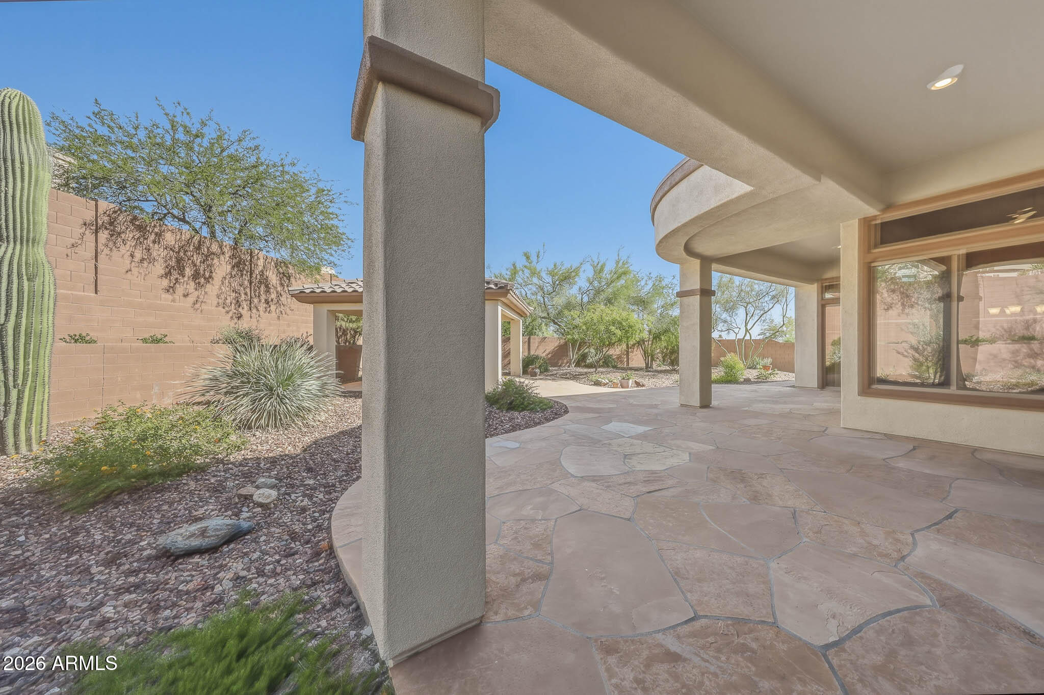2129 West Legends Way Anthem, AZ 85086 - Photo 42 of 57 a view of a porch with a yard