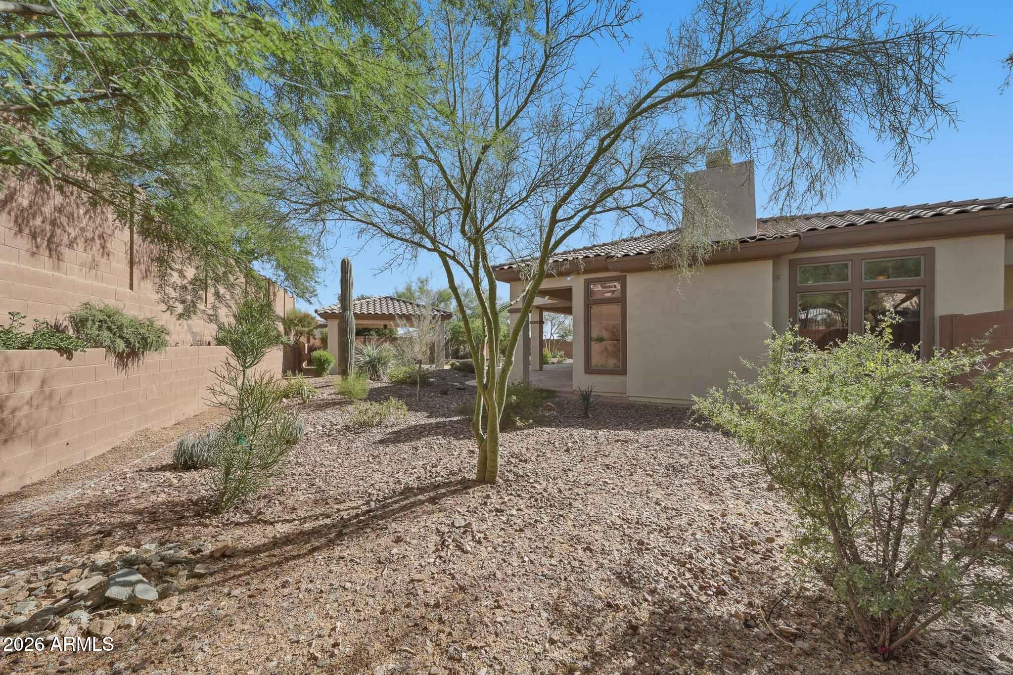 2129 West Legends Way Anthem, AZ 85086 - Photo 45 of 57 a backyard of a house with lots of green space