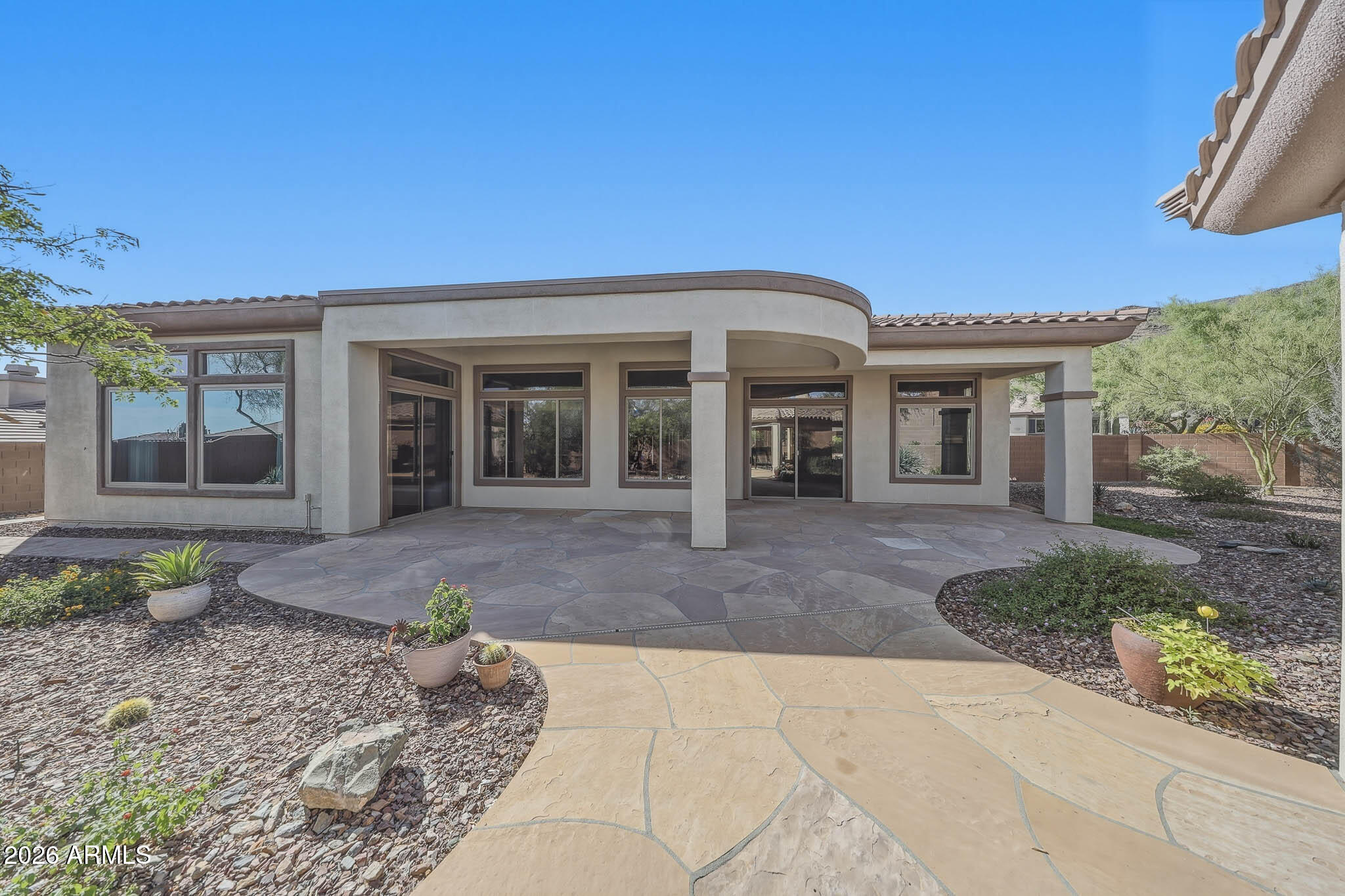 2129 West Legends Way Anthem, AZ 85086 - Photo 49 of 57 a view of a house with a backyard