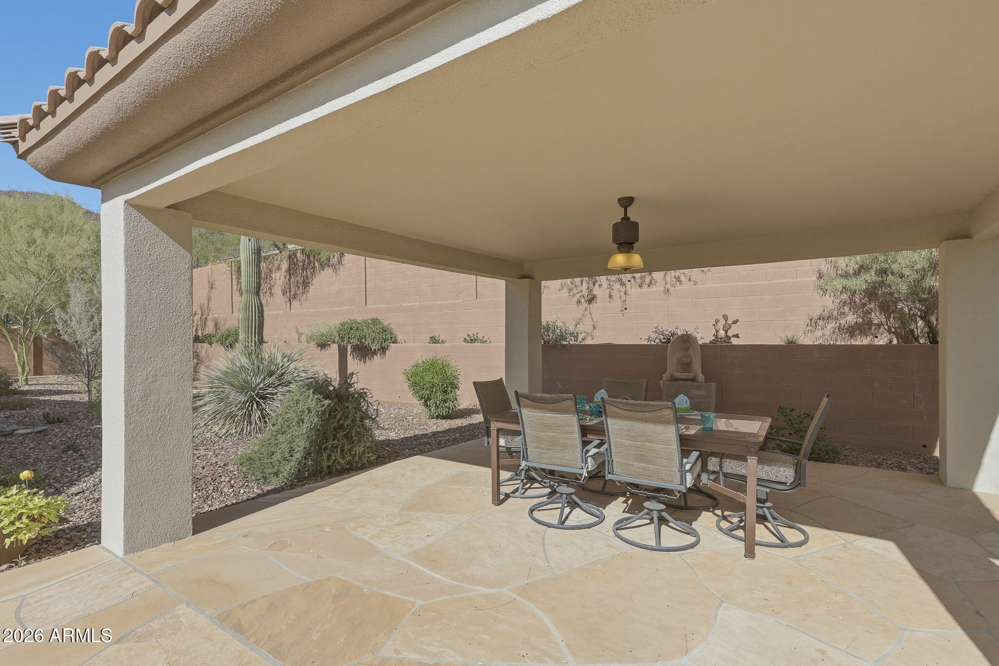 2129 West Legends Way Anthem, AZ 85086 - Photo 50 of 57 a view of a patio with a table and chairs and potted plants