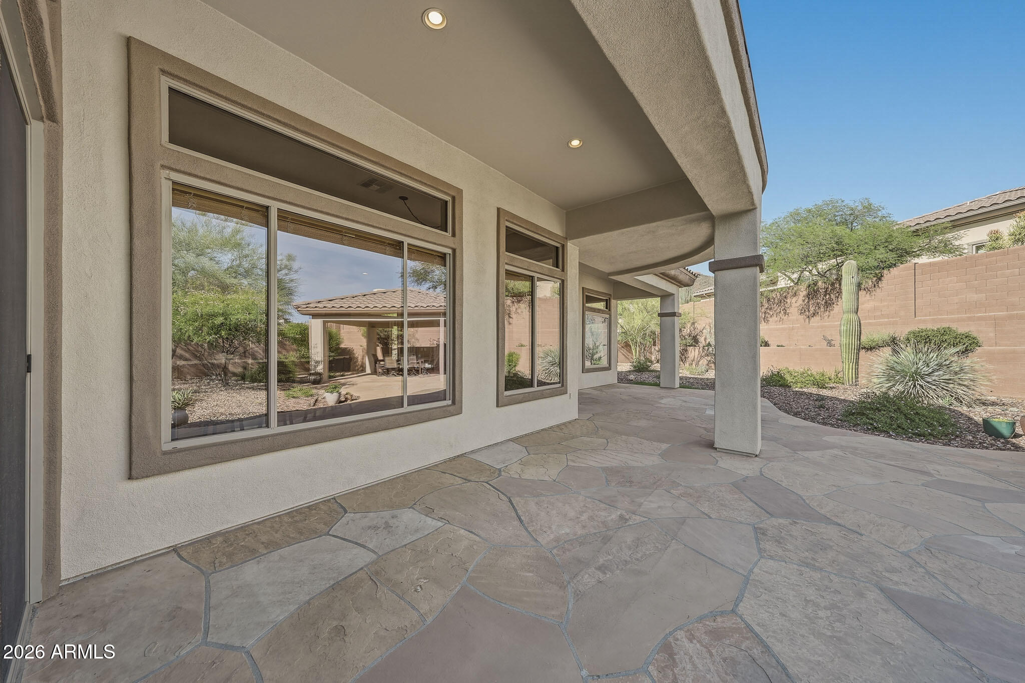 2129 West Legends Way Anthem, AZ 85086 - Photo 52 of 57 a view of a house with porch and garden
