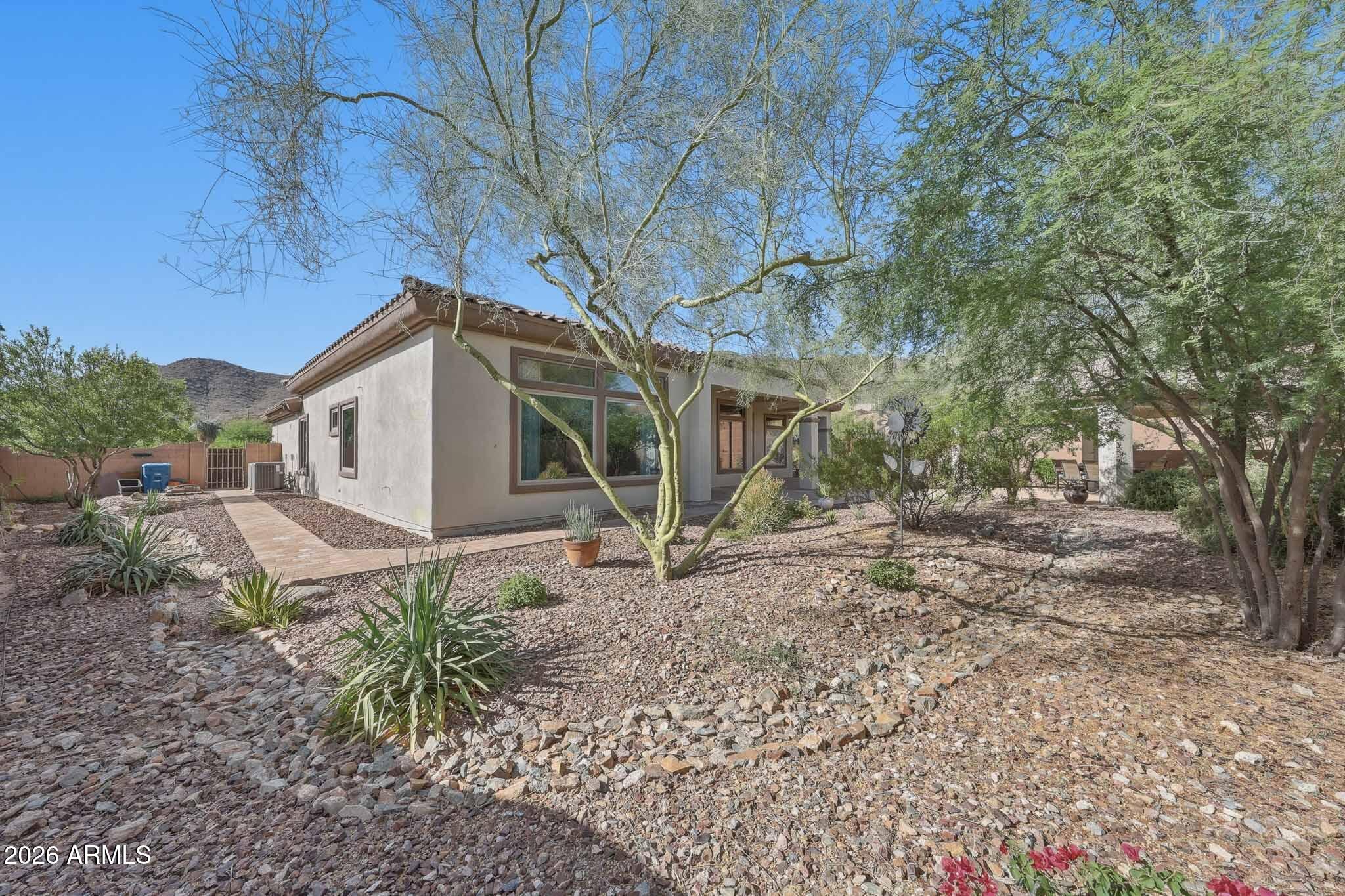 2129 West Legends Way Anthem, AZ 85086 - Photo 54 of 57 a view of a house with a yard