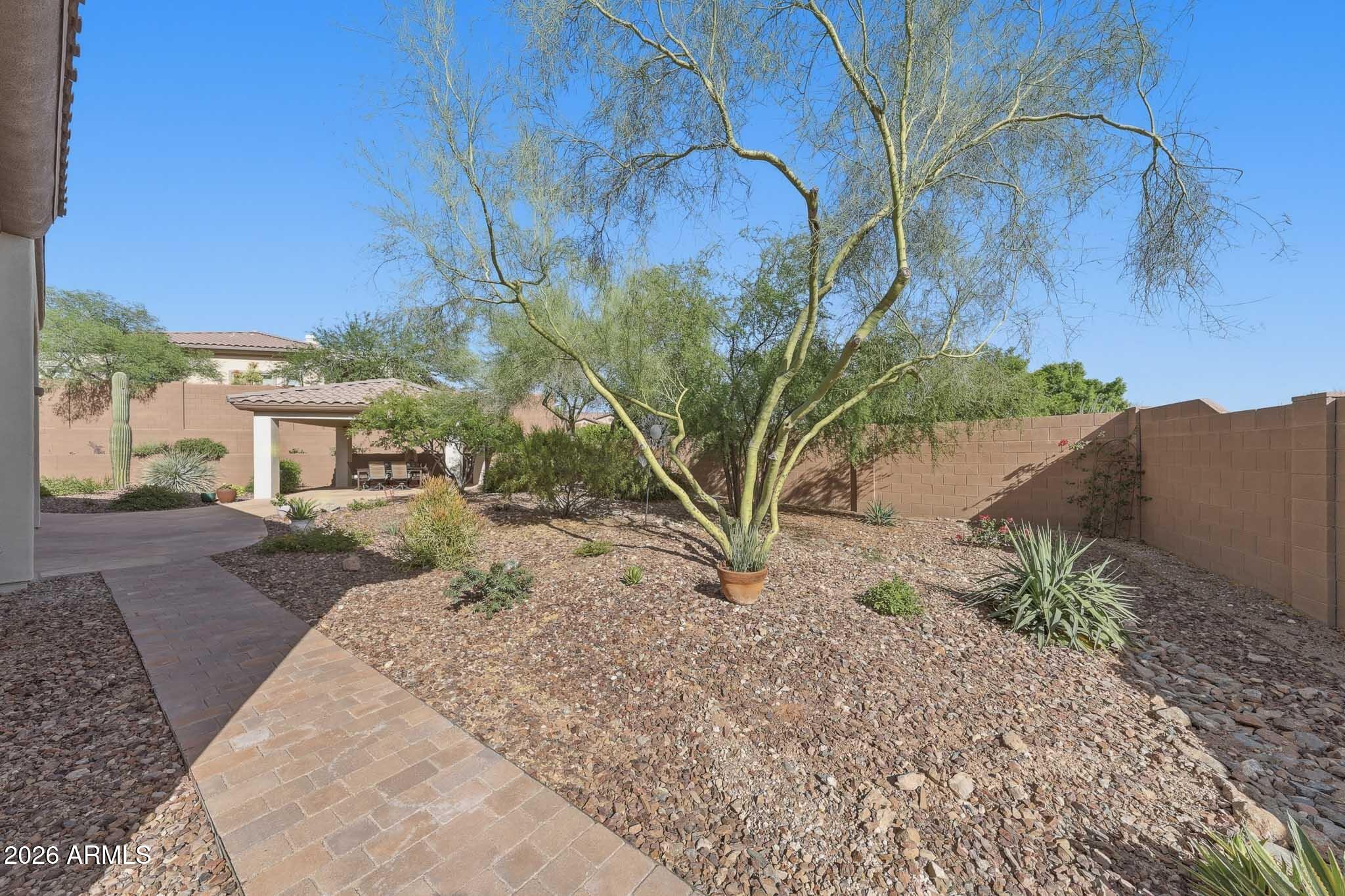 2129 West Legends Way Anthem, AZ 85086 - Photo 55 of 57 a view of a yard with plants and trees