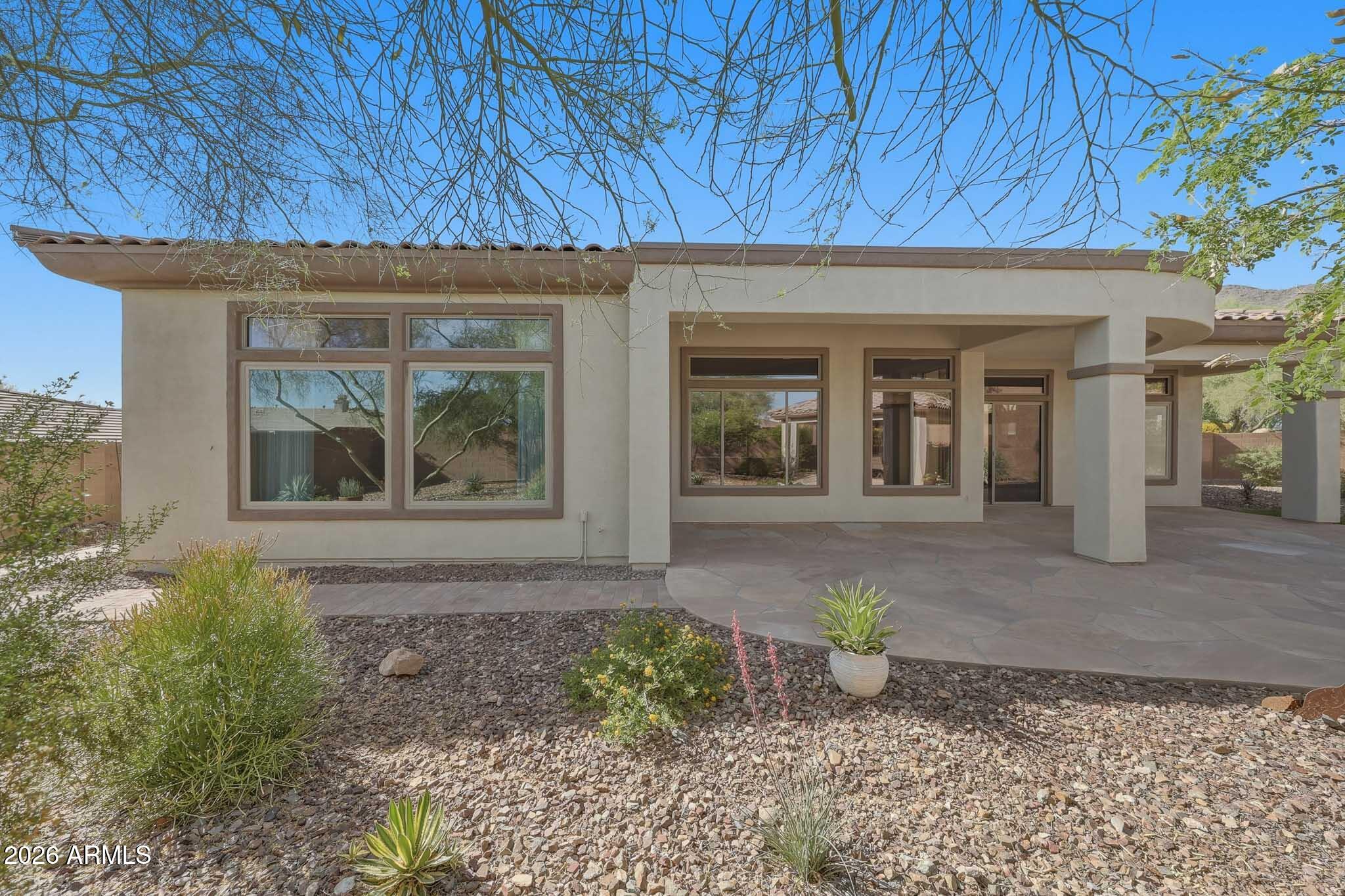2129 West Legends Way Anthem, AZ 85086 - Photo 56 of 57 a front view of a house with garden