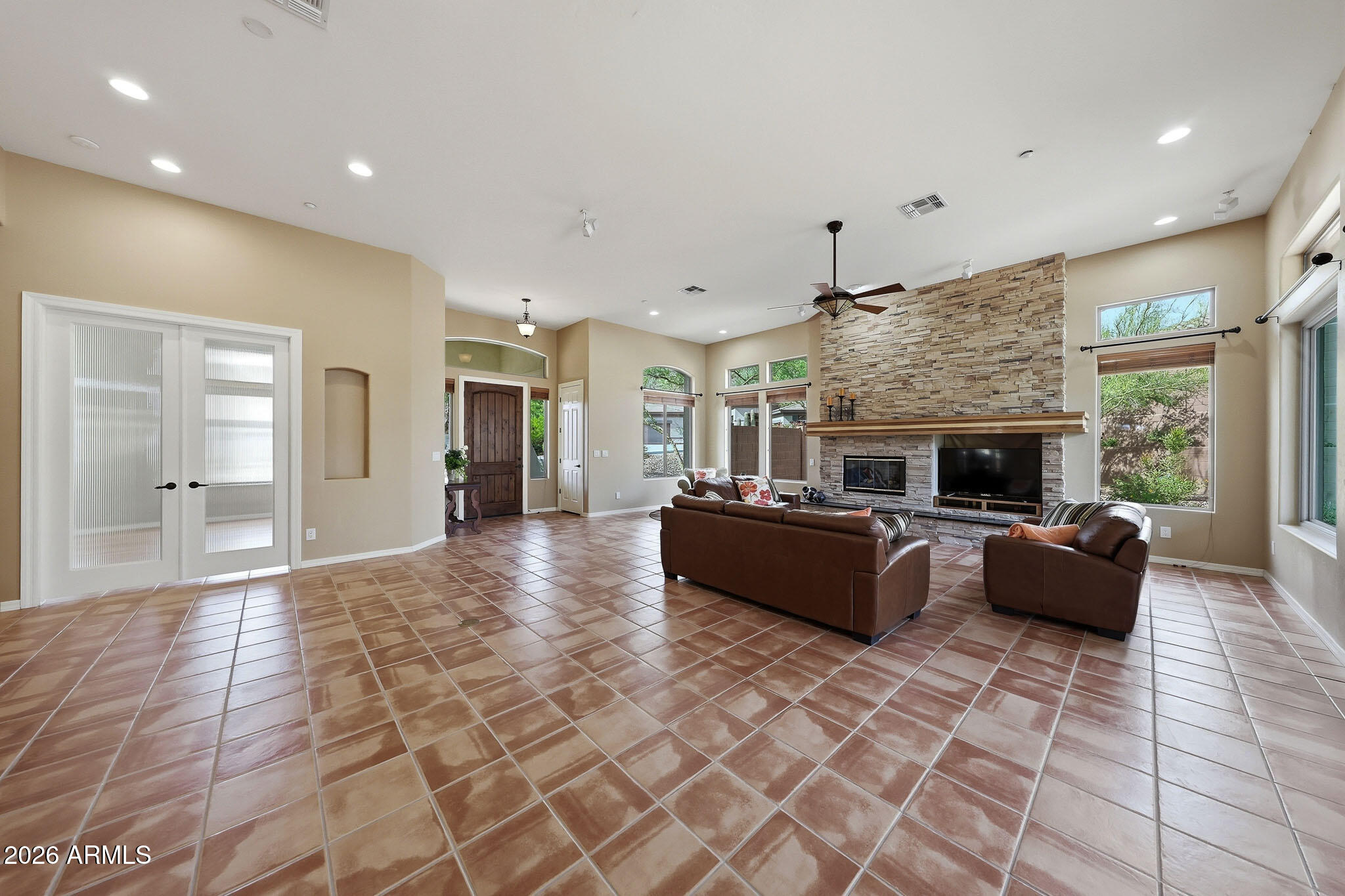 2129 West Legends Way Anthem, AZ 85086 - Photo 10 of 57 a living room with furniture and fireplace