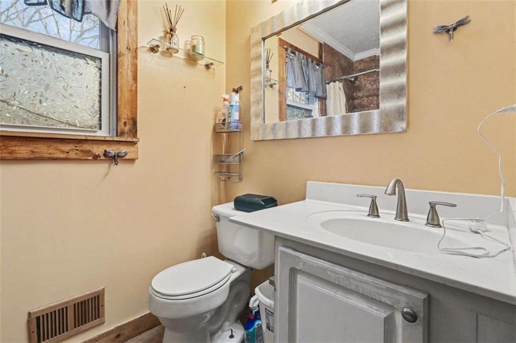 7495 Phillips Road Chattahoochee Hills, GA 30268 - Photo 11 of 26 a bathroom with a sink toilet and shower