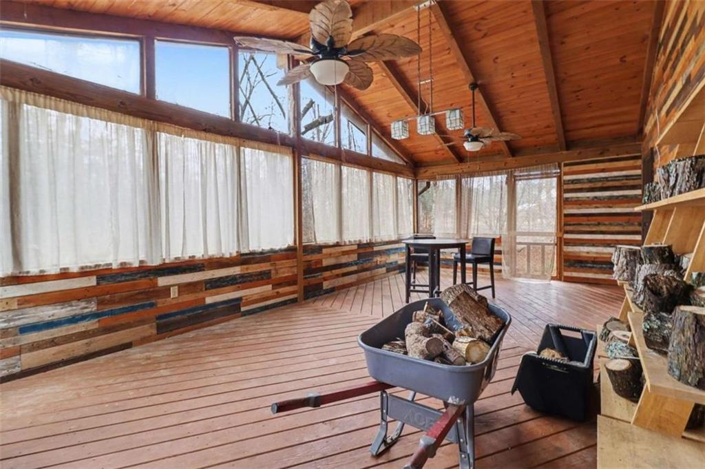 7495 Phillips Road Chattahoochee Hills, GA 30268 - Photo 16 of 26 a very nice looking room with many windows and furniture