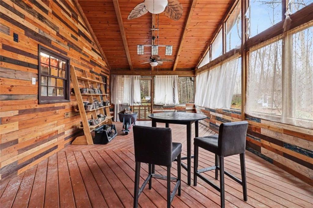 7495 Phillips Road Chattahoochee Hills, GA 30268 - Photo 17 of 26 a view of a dining room with furniture window and wooden floor