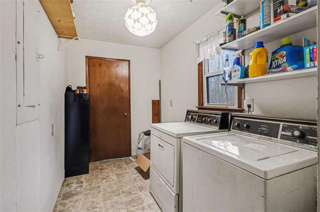 7495 Phillips Road Chattahoochee Hills, GA 30268 - Photo 20 of 26 a utility room with dryer and washer
