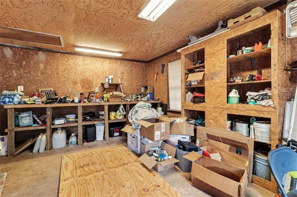 7495 Phillips Road Chattahoochee Hills, GA 30268 - Photo 22 of 26 a bed room with a bed and a book shelf