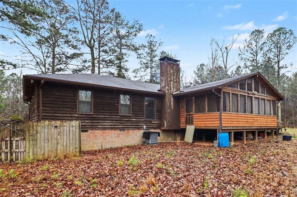 7495 Phillips Road Chattahoochee Hills, GA 30268 - Photo 24 of 26 a front view of a house with a yard