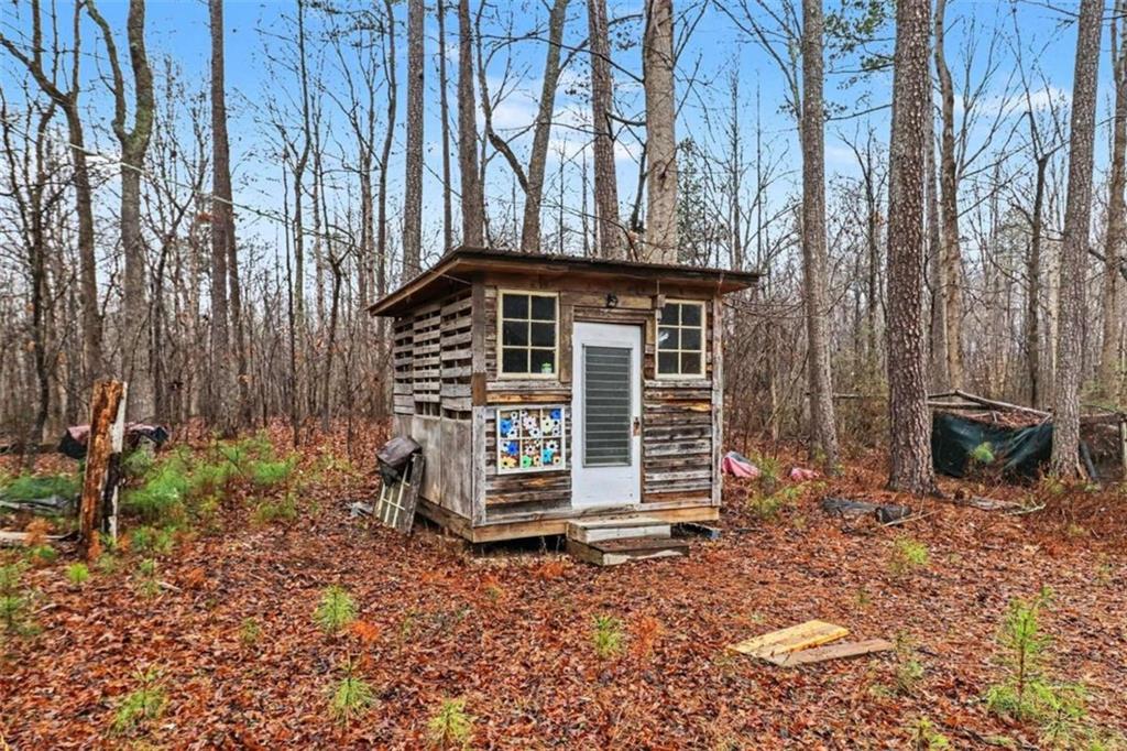 7495 Phillips Road Chattahoochee Hills, GA 30268 - Photo 26 of 26 a front view of a house with garden