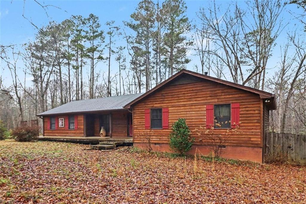 7495 Phillips Road Chattahoochee Hills, GA 30268 - Photo 3 of 26 a view of house with backyard and garden