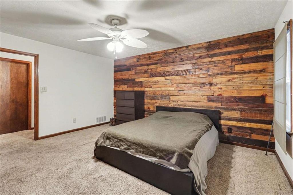 7495 Phillips Road Chattahoochee Hills, GA 30268 - Photo 9 of 26 a living room with fireplace furniture and a ceiling fan