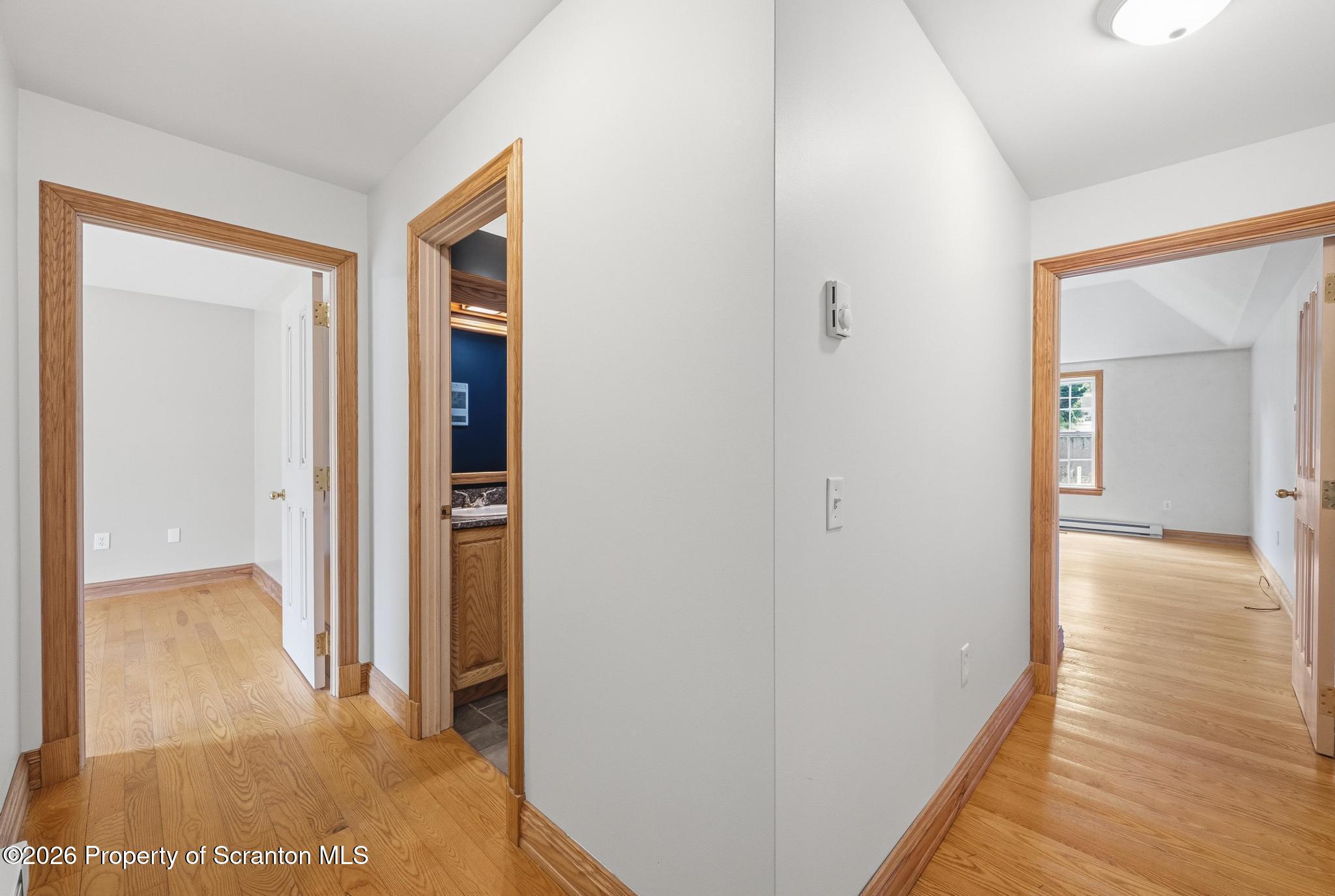 116 Forge Street Old Forge, PA 18518 - Photo 21 of 49 a view of a hallway with wooden floor