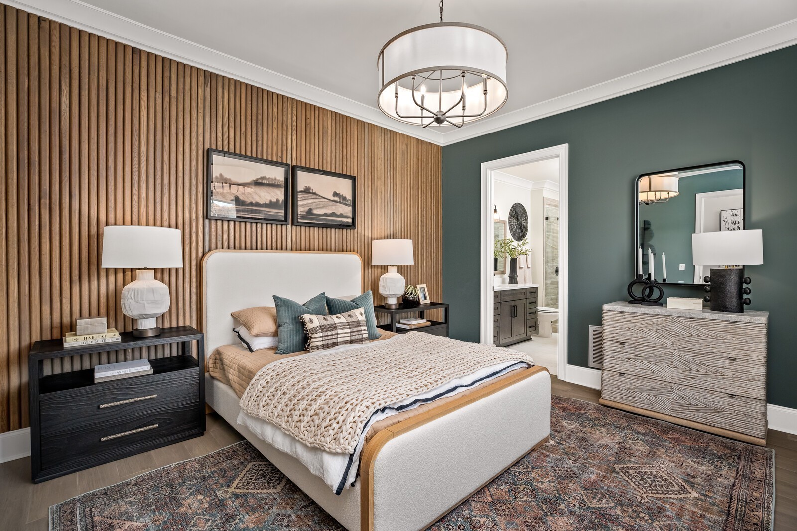 3206 Hunziker Lane Fairview, TN 37062 - Photo 35 of 75 a bedroom with a large bed and a chandelier