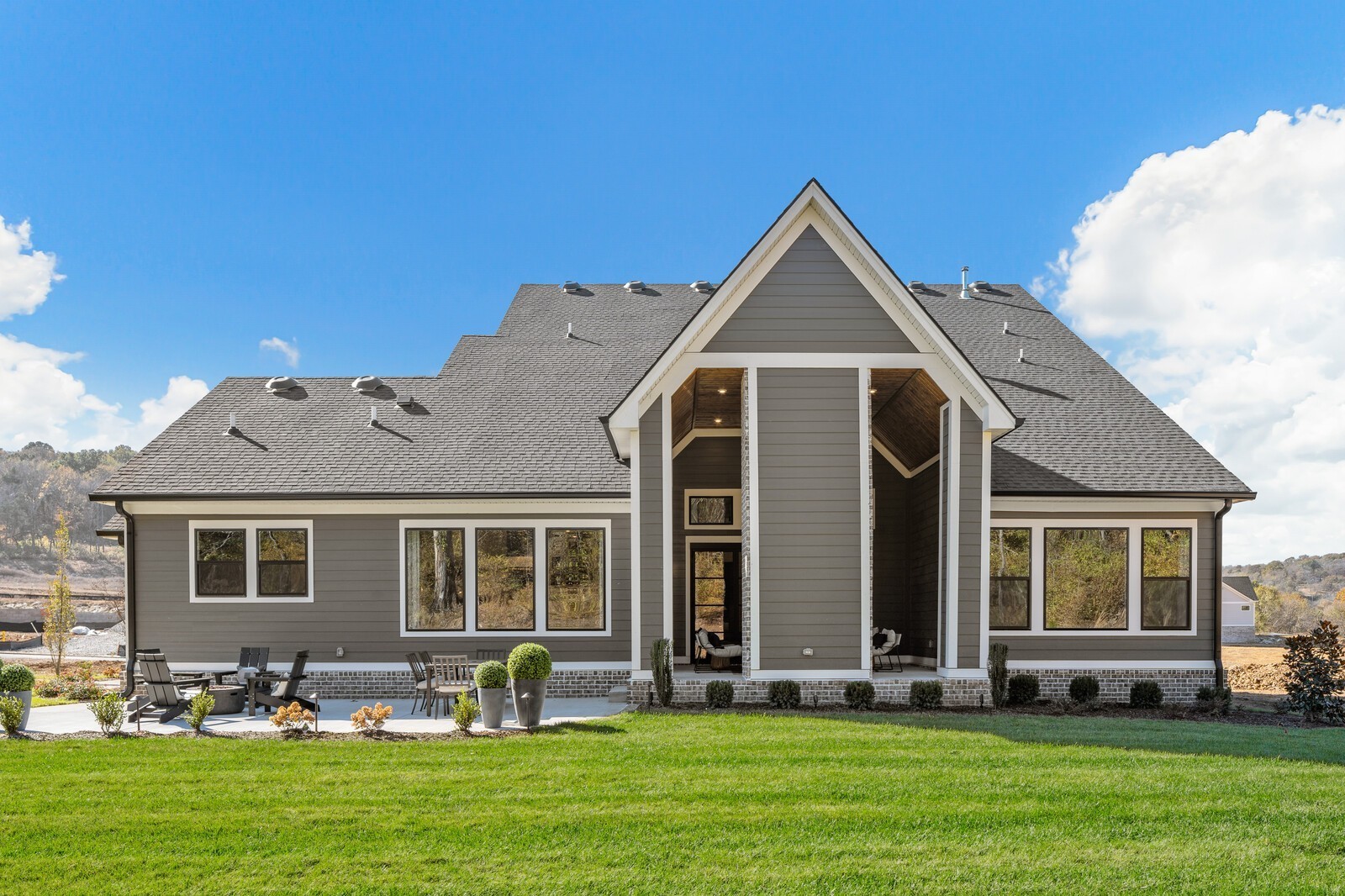 3206 Hunziker Lane Fairview, TN 37062 - Photo 57 of 75 a front view of a house with a garden and plants