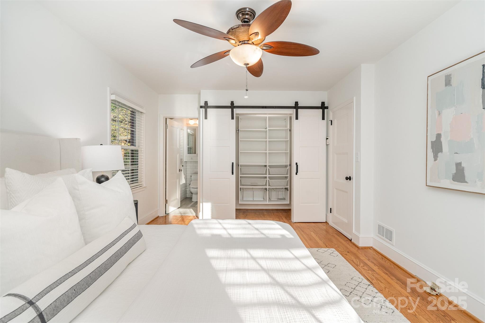 5411 Doncaster Drive Charlotte, NC 28211 - Photo 18 of 40 a bedroom with a bed and a large mirror