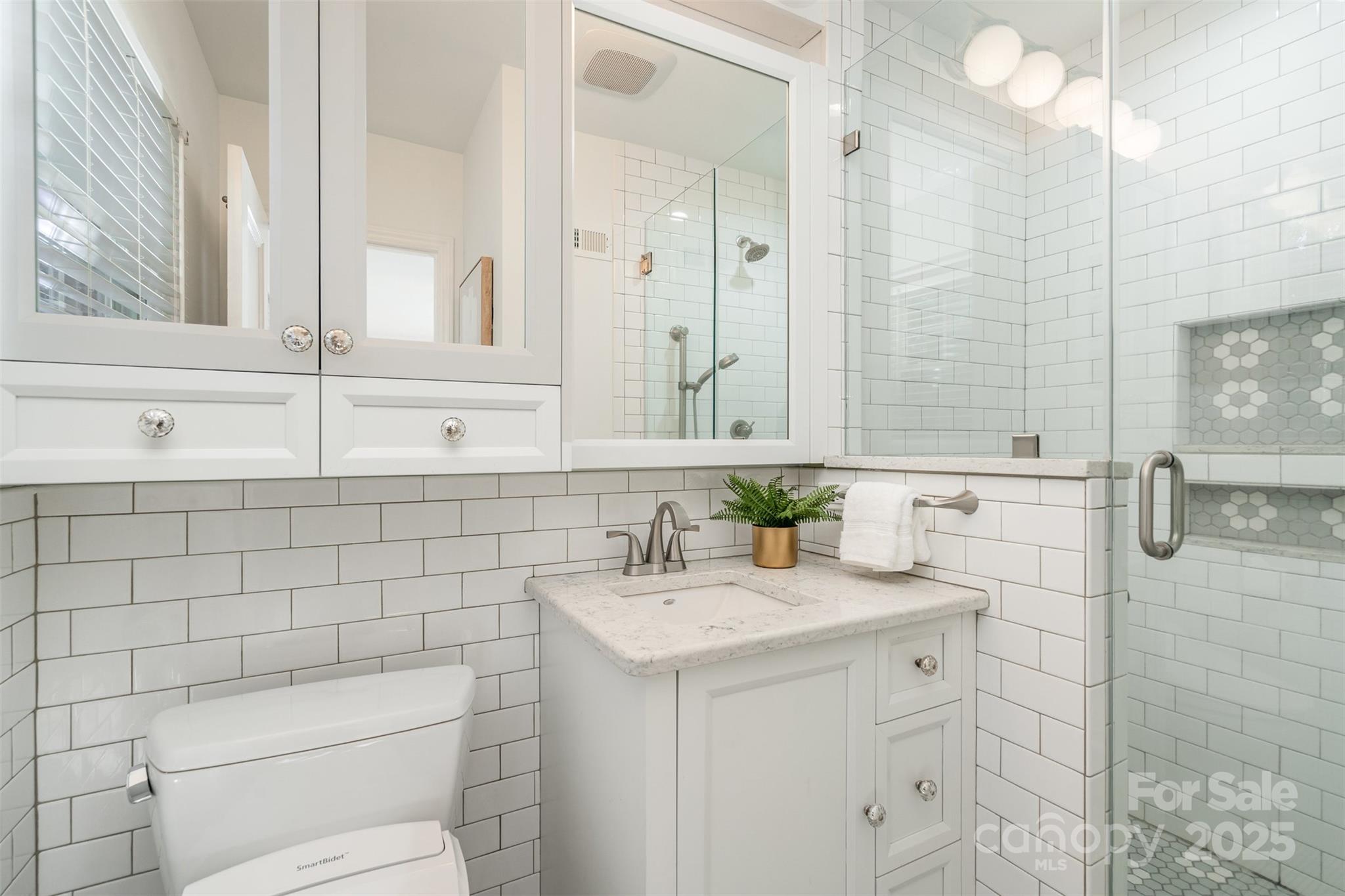 5411 Doncaster Drive Charlotte, NC 28211 - Photo 19 of 40 a bathroom with a sink toilet and shower