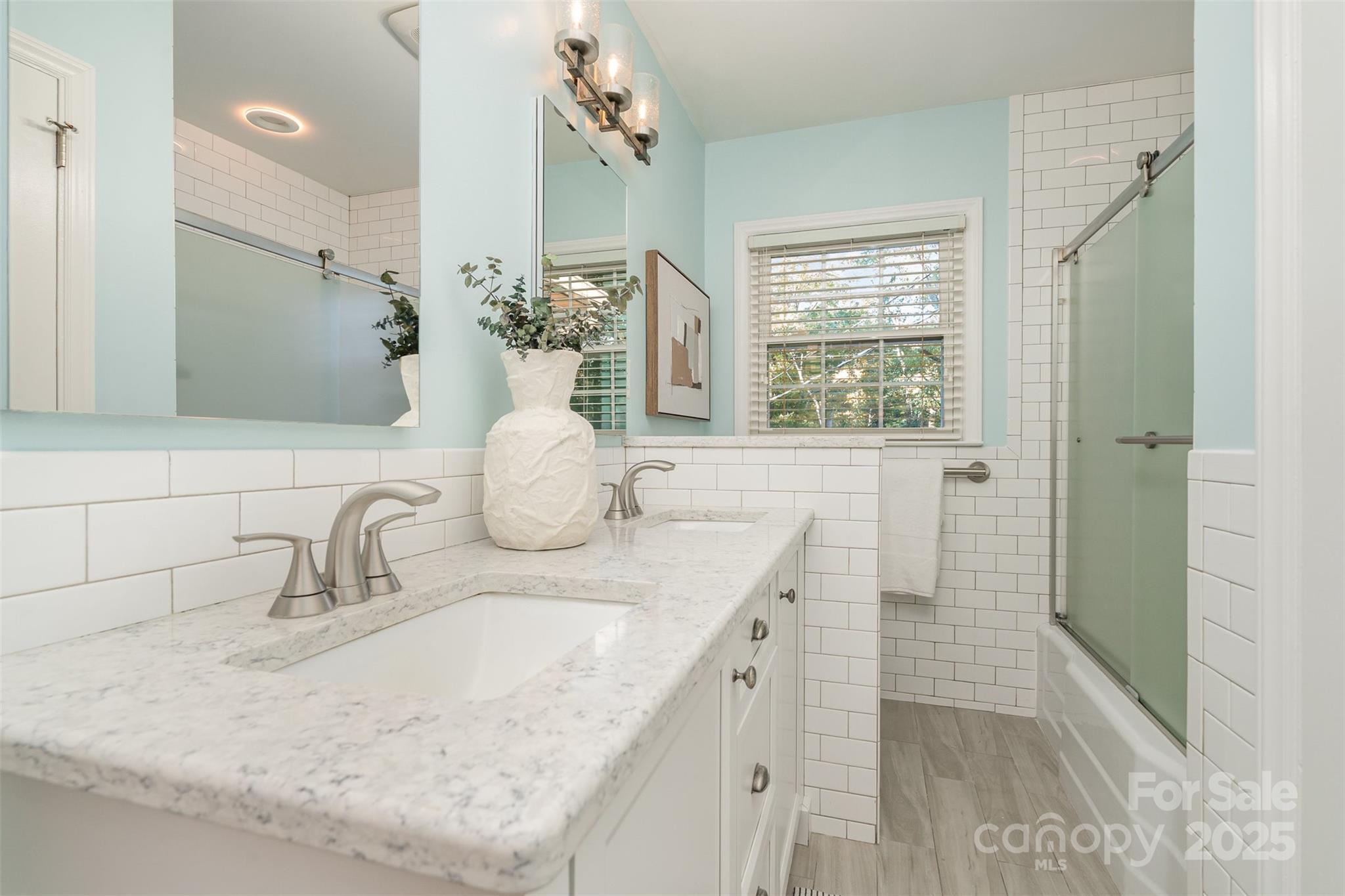 5411 Doncaster Drive Charlotte, NC 28211 - Photo 24 of 40 a bathroom with a granite countertop sink mirror and double