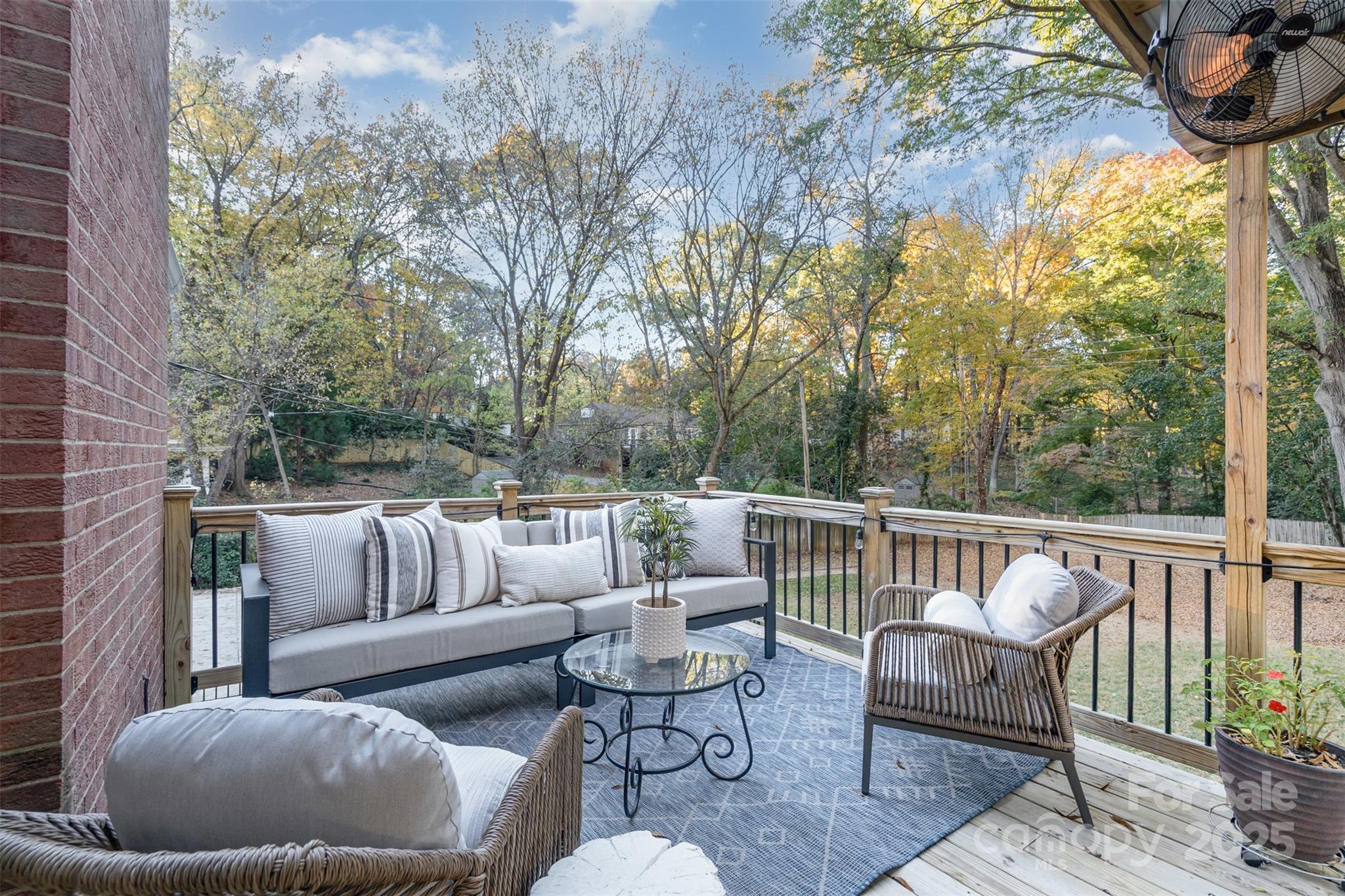 5411 Doncaster Drive Charlotte, NC 28211 - Photo 33 of 40 a roof deck with couches and wooden fence