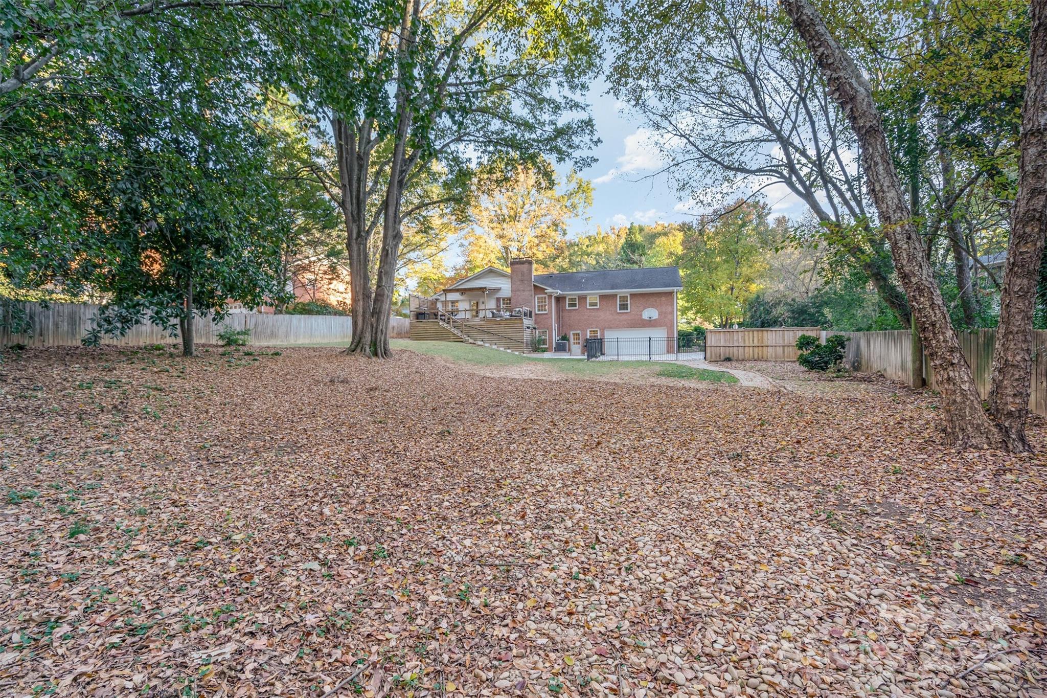 5411 Doncaster Drive Charlotte, NC 28211 - Photo 37 of 40 a view of a house with a yard and tree s