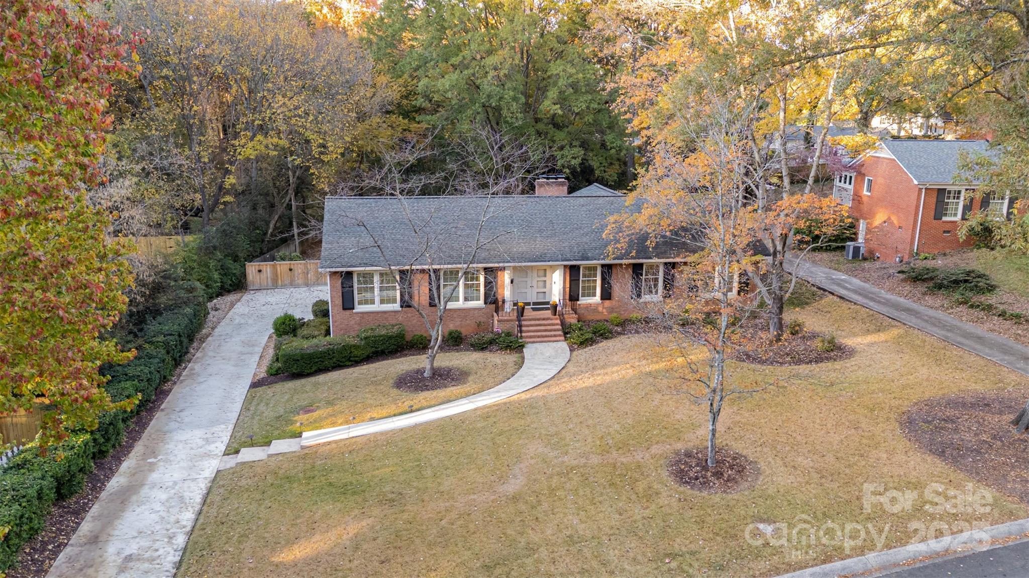 5411 Doncaster Drive Charlotte, NC 28211 - Photo 38 of 40 a front view of a house with a yard