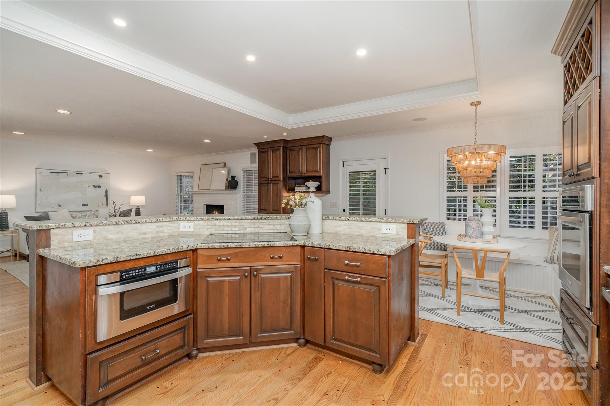 5411 Doncaster Drive Charlotte, NC 28211 - Photo 10 of 40 a kitchen with stainless steel appliances granite countertop a stove and cabinets