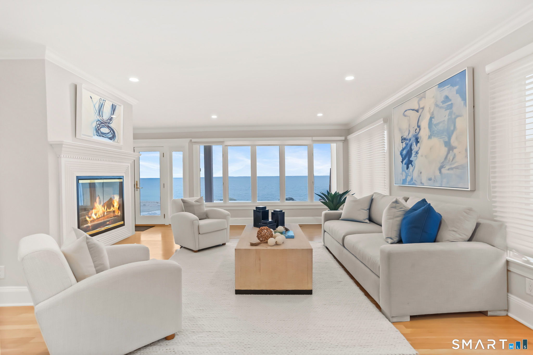 1149 Fairfield Beach Road Fairfield, CT 06824 - Photo 14 of 44 Water views at every turn. Living Room provides a more formal feeling & has adjacent open Dining and Family rooms