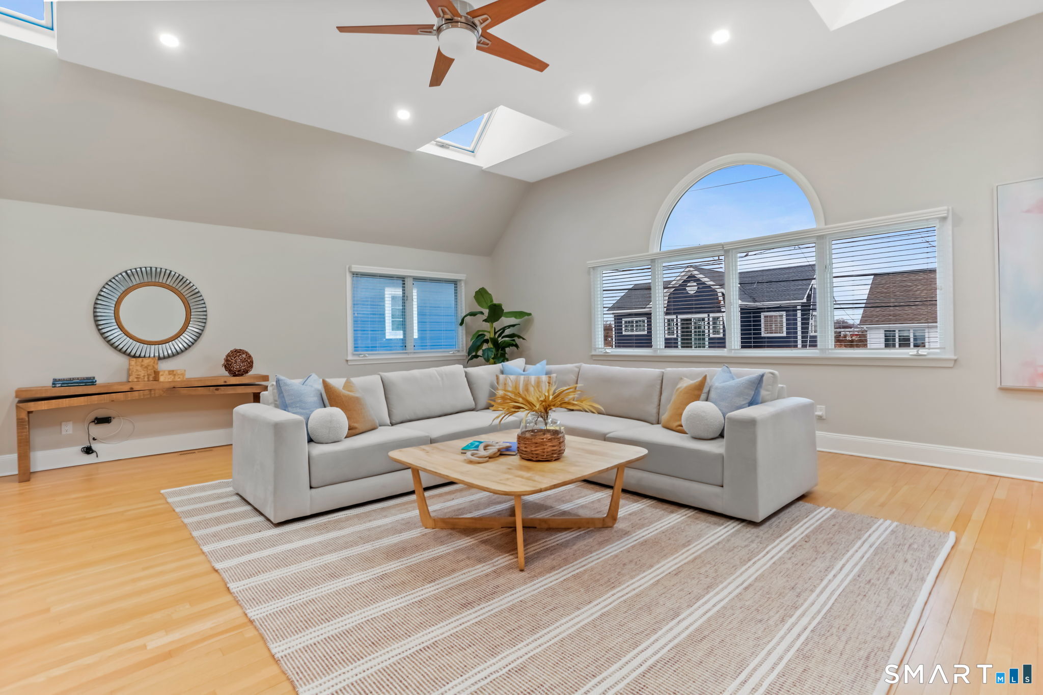 1149 Fairfield Beach Road Fairfield, CT 06824 - Photo 21 of 44 Skylights and the palladian window allows light to pour in ......while ceiling fam circulates cool beach breezes throughout the home