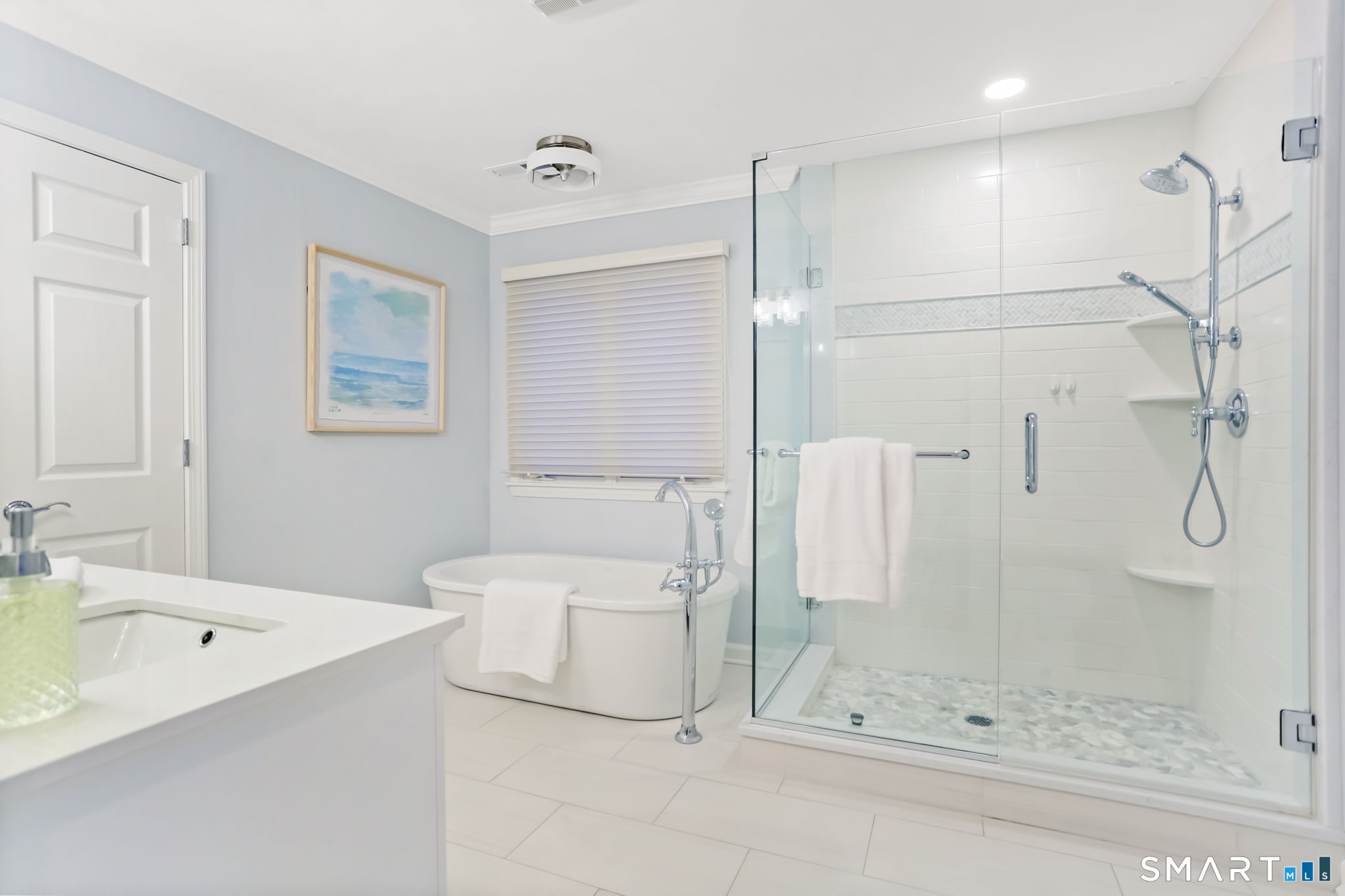 1149 Fairfield Beach Road Fairfield, CT 06824 - Photo 25 of 44 End the day in your soaking tub in your newly updated Primary Bath. Lux shower has river rock tile floor and glass doors on 2 sides
