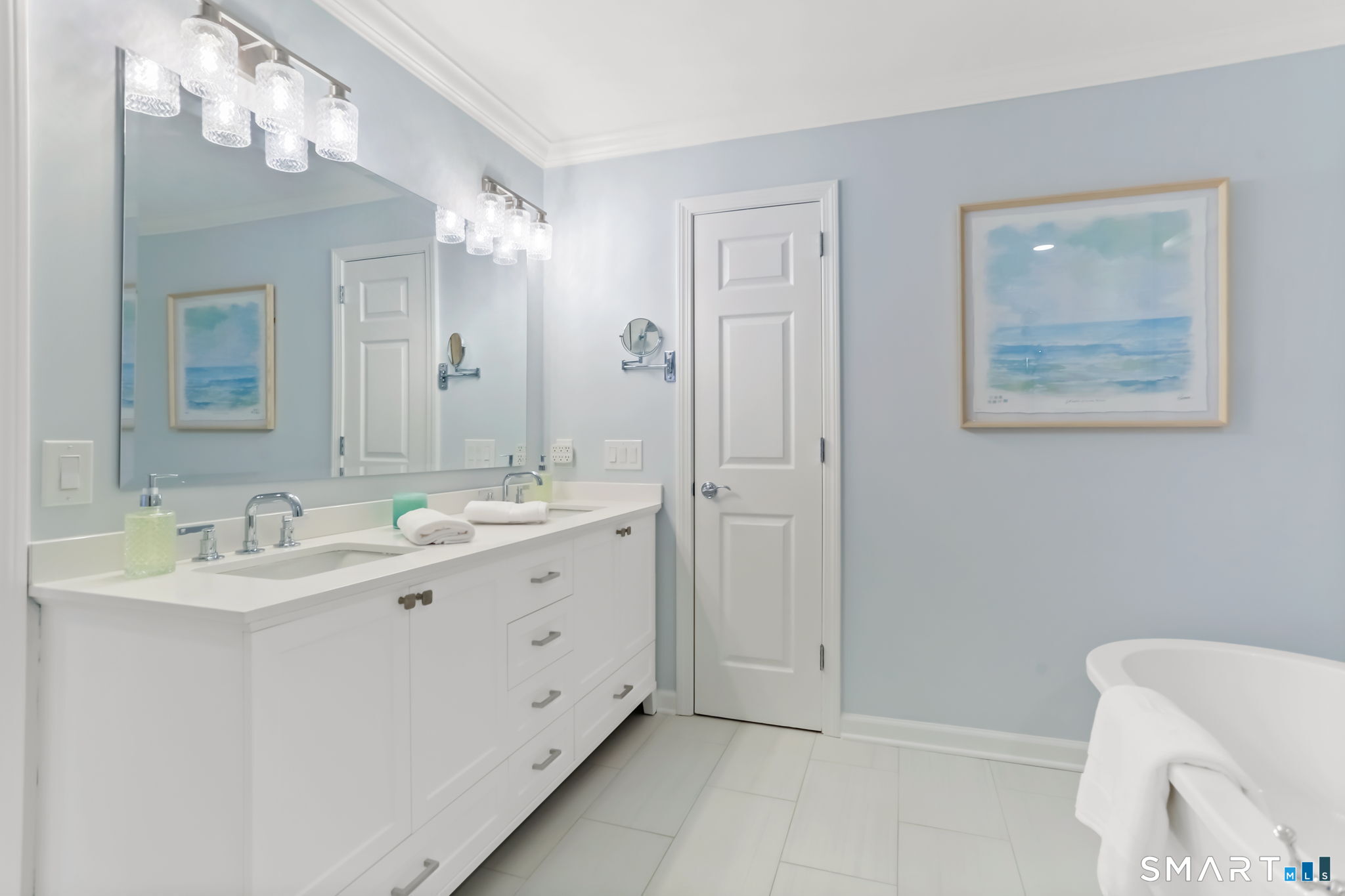 1149 Fairfield Beach Road Fairfield, CT 06824 - Photo 26 of 44 His and Hers double vanities make morning prep a breeze.....overhead lights and interior linen closet