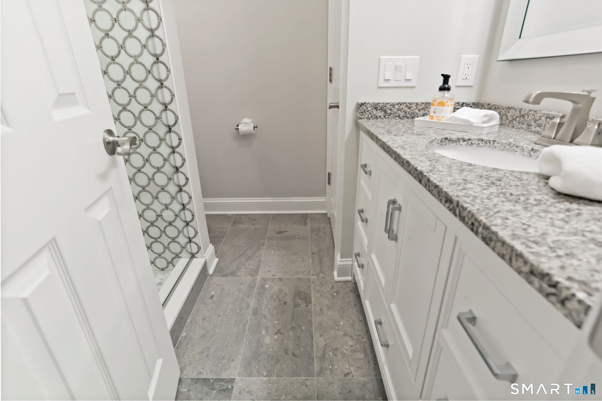 1149 Fairfield Beach Road Fairfield, CT 06824 - Photo 38 of 44 Full private guest bathroom w/cool tiled shower that will make your guests smile.