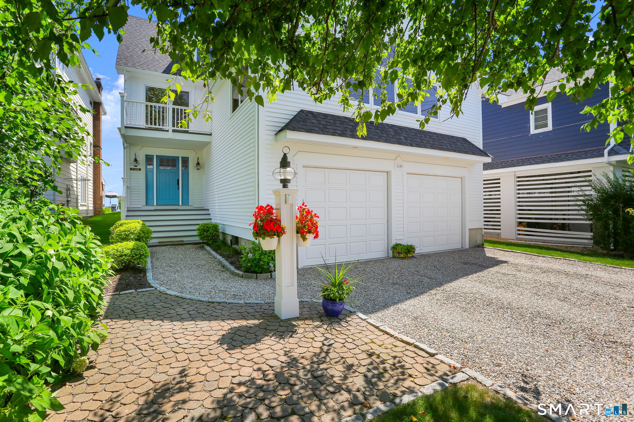 1149 Fairfield Beach Road Fairfield, CT 06824 - Photo 5 of 44 Be greeted by your pretty entry w/ gravel driveway and fun beachy blue door. Entry offers coverage and protection from the weather for package delivery