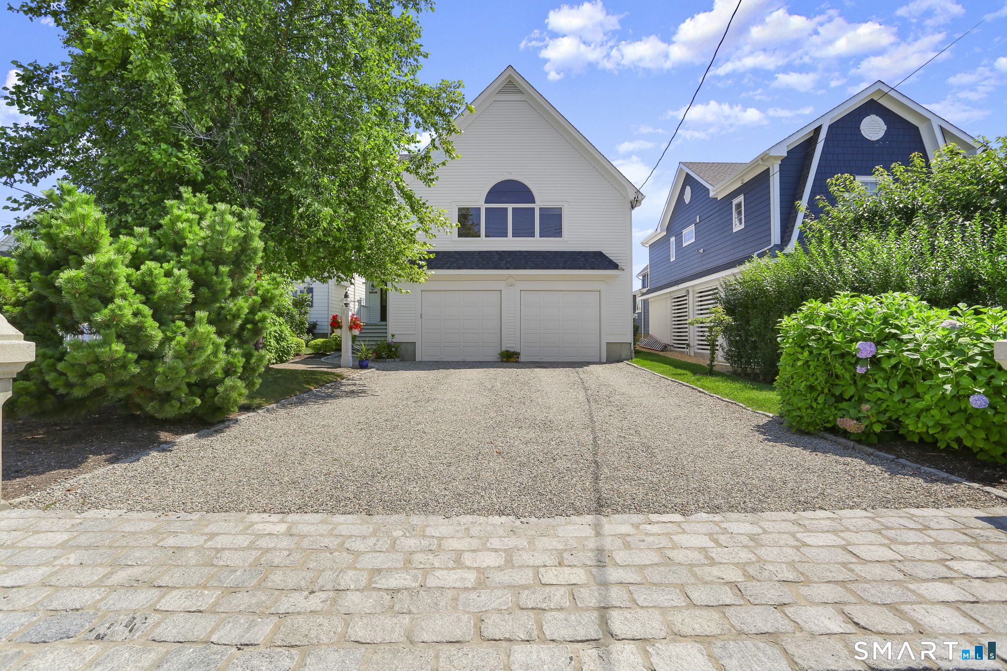 1149 Fairfield Beach Road Fairfield, CT 06824 - Photo 6 of 44 One of 2 sets of 2 car attached garages (other is across), this one w/12 foot ceilings perfect for that Suburban or truck w/ ladder rack storage. Inside find a rare generous crawlspace, great for storing patio furniture, paddle boards and kayaks