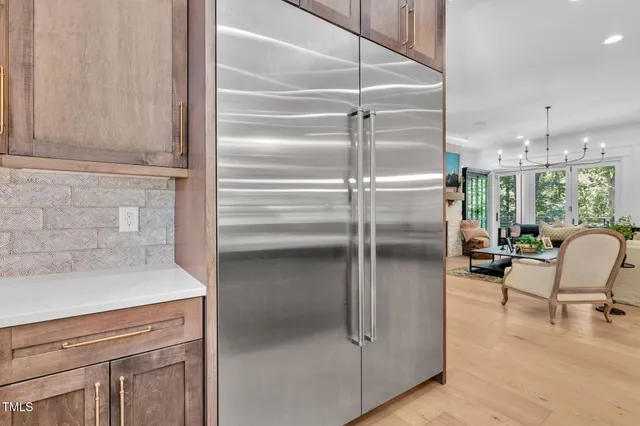 a kitchen with a dining table and chairs