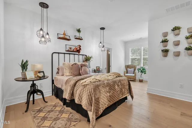 a bathroom with a granite countertop sink a toilet and mirror